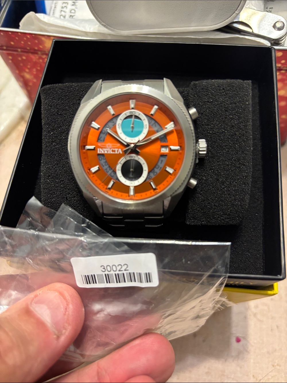 Invicta Orange Dial Watch with Teal and Black Subdials